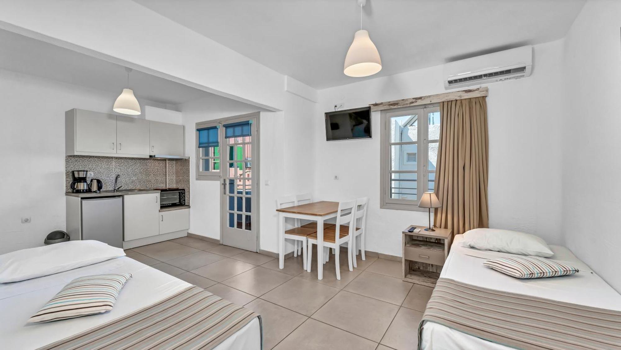 Junior Suite Quadruple Bedroom & Living Room